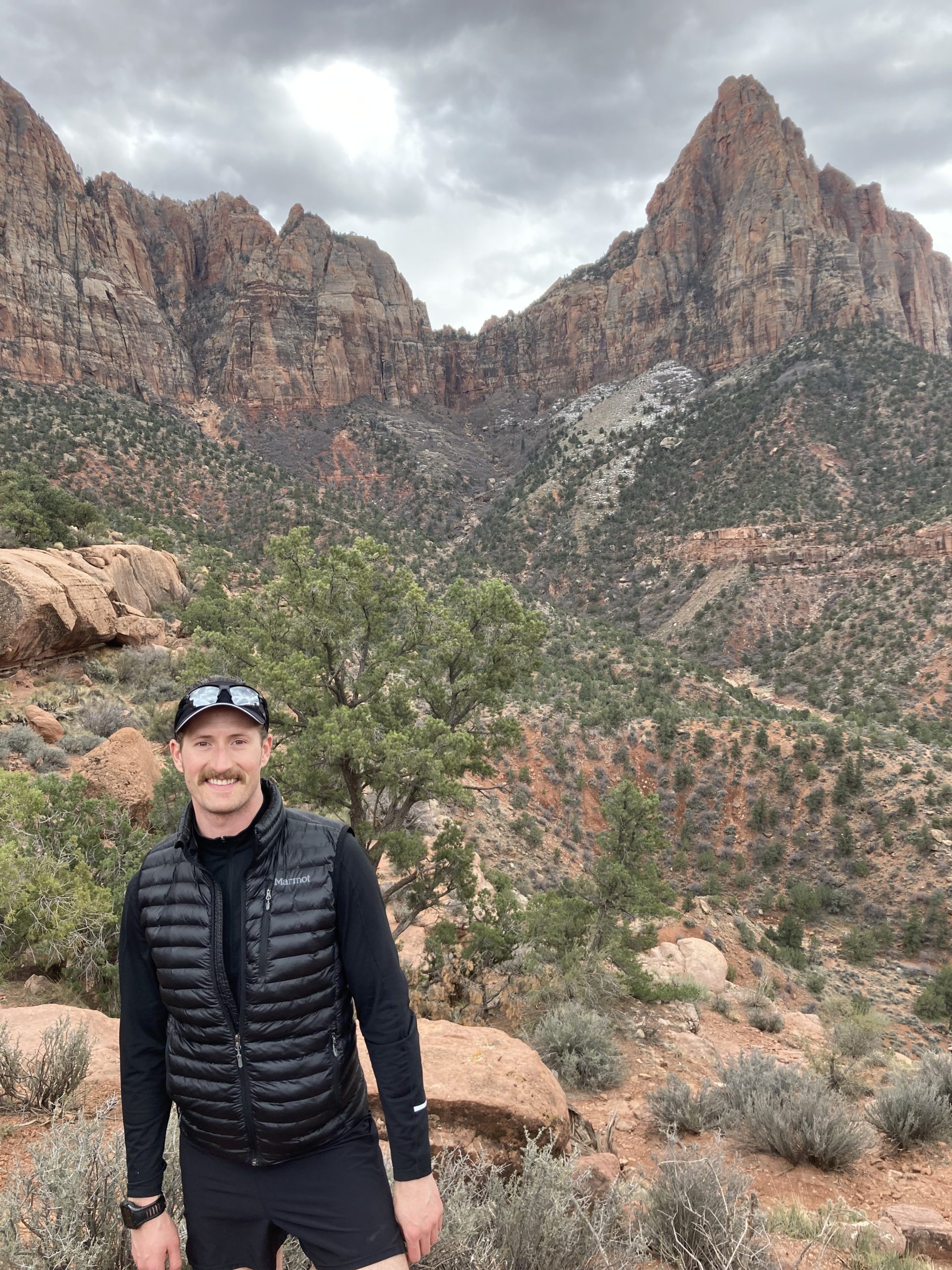 Man standing with mountain landscape behind